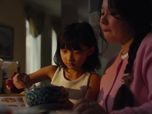 Two girls in the kitchen cooking together