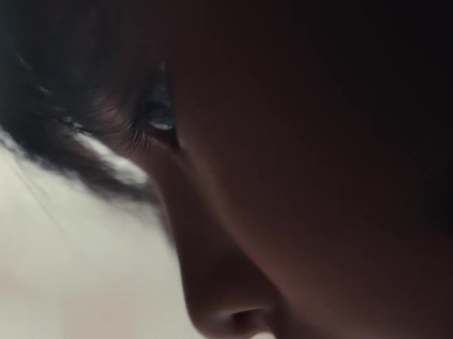 A child is looking down at something