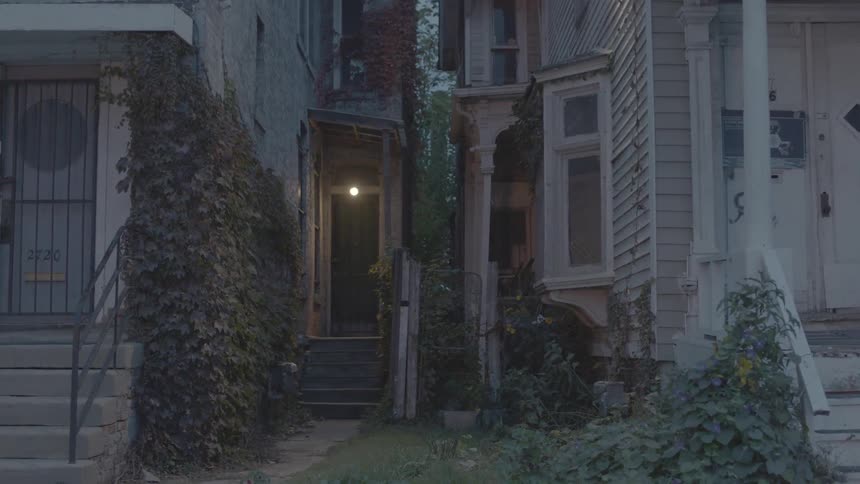 A couple of old houses being filmed from the front