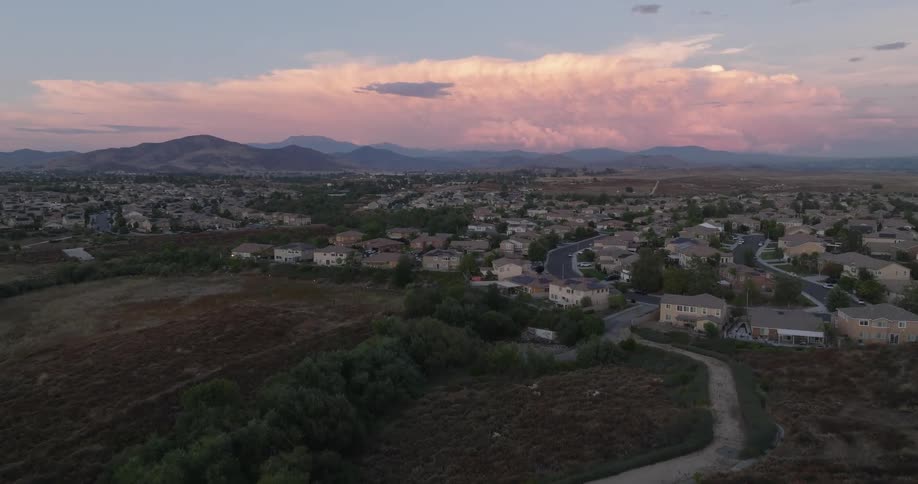 Aerial view of a red sky morning above a residential neighborhood