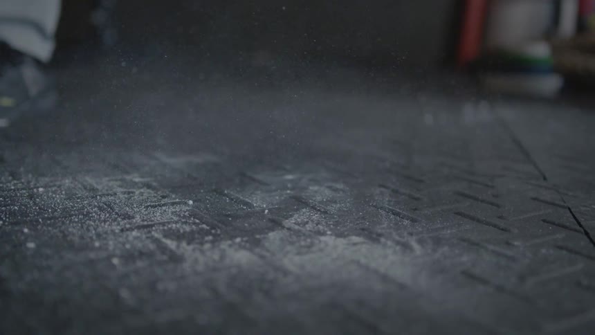 A barbell hits the floor and bounces