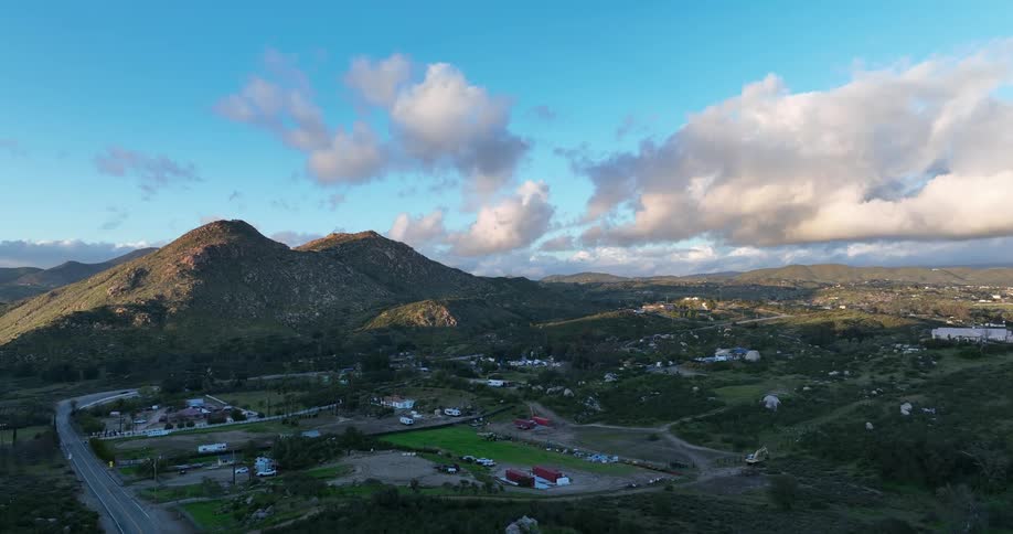 Aerial panorama of a city in a region of countryside with mountains and hills