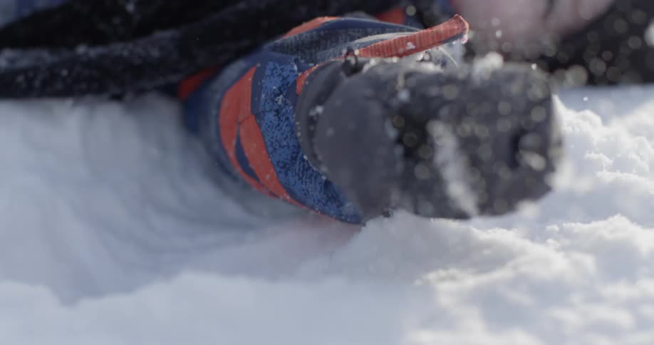 A child lays in the snow