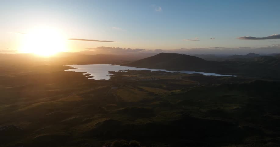 The sun is rising on the horizon