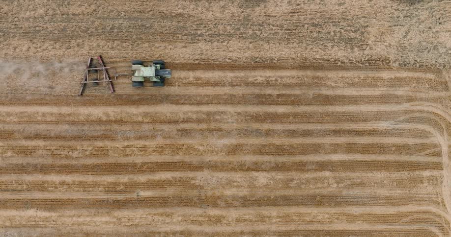Aerial view of an agricultural machine planting crops