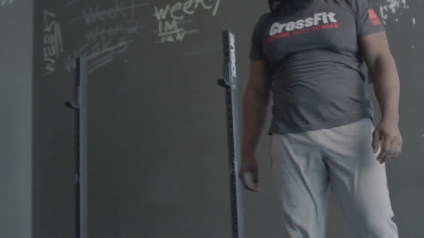 A man is dead lifting a heavy weight