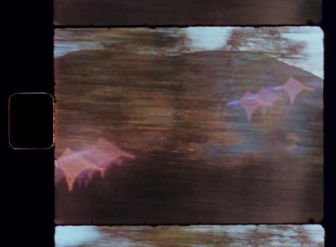 A motion clip of a mountainand s lake in the woods