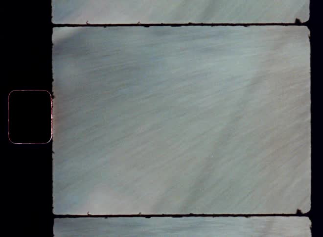 A concrete floor passing quickly in an old image