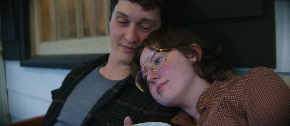 Woman resting her face on her boyfriends shoulder