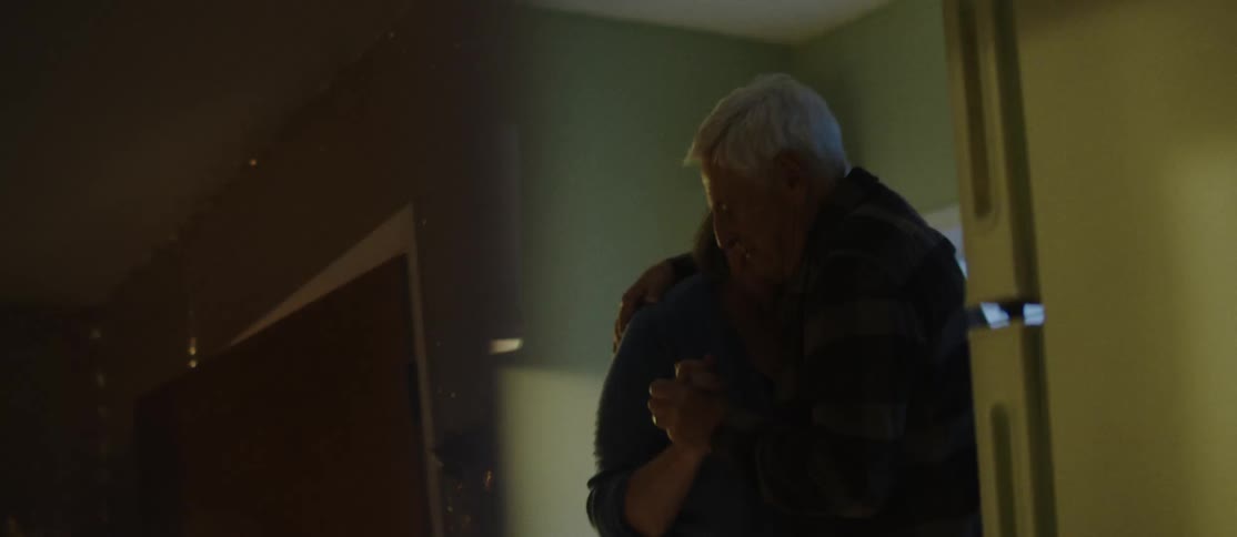 Elderly couple dancing together