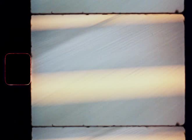 Asphalt street in motion with reflections of sun and shadow