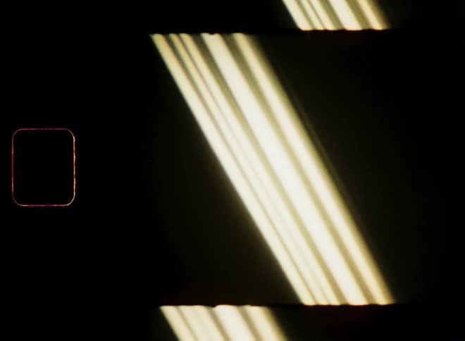 Several yellow lights passing through an environment that is completely dark and in various positions