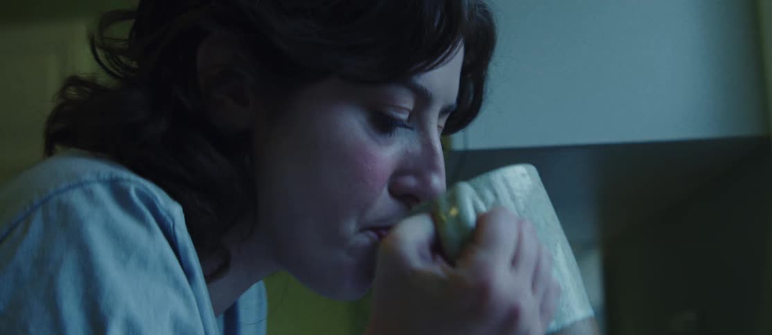 Side portrait of a woman drinking coffee