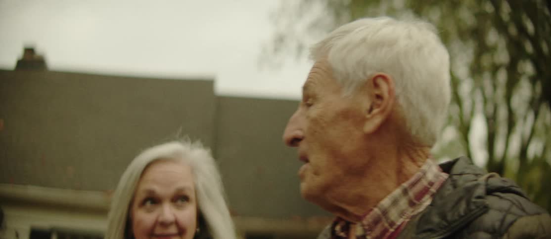 A footage of an elderly couples walking and having a conversation