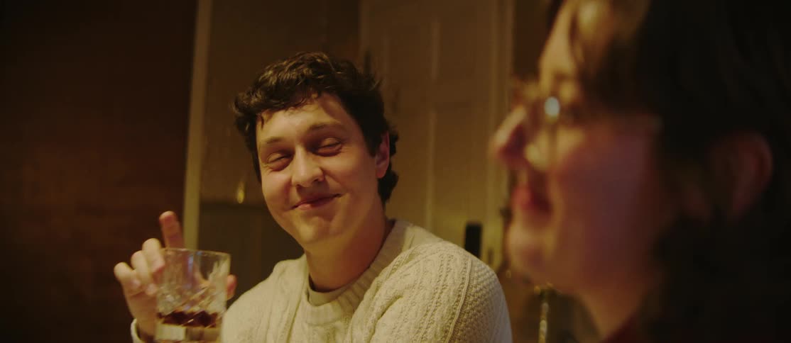 A clip of people having a drink and conversing