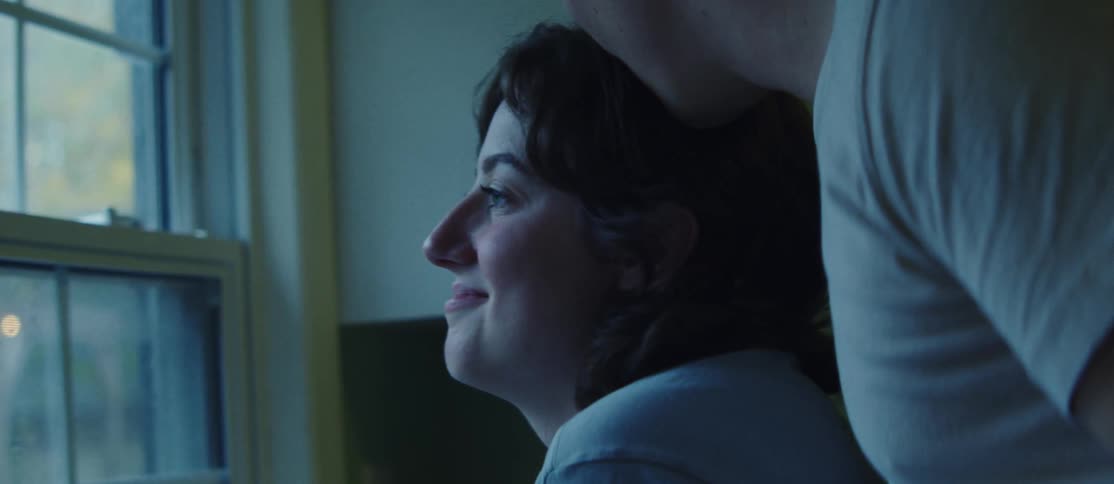 Man kissing a woman on the head