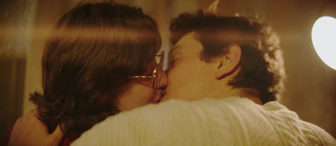 A couple talk and kiss