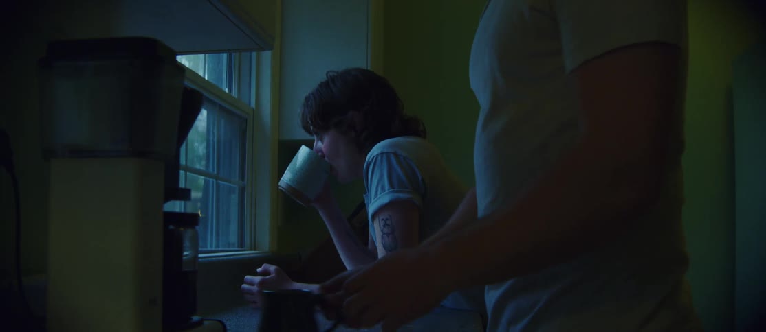 Woman looking out the window and then her boyfriend arrives and gives her a kiss