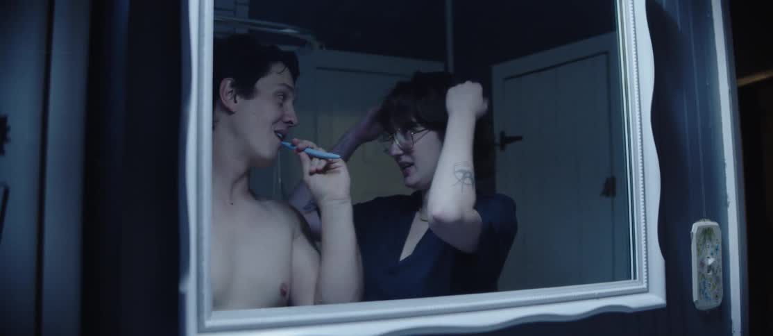 A clip of a couple having a conversation in the bathroom