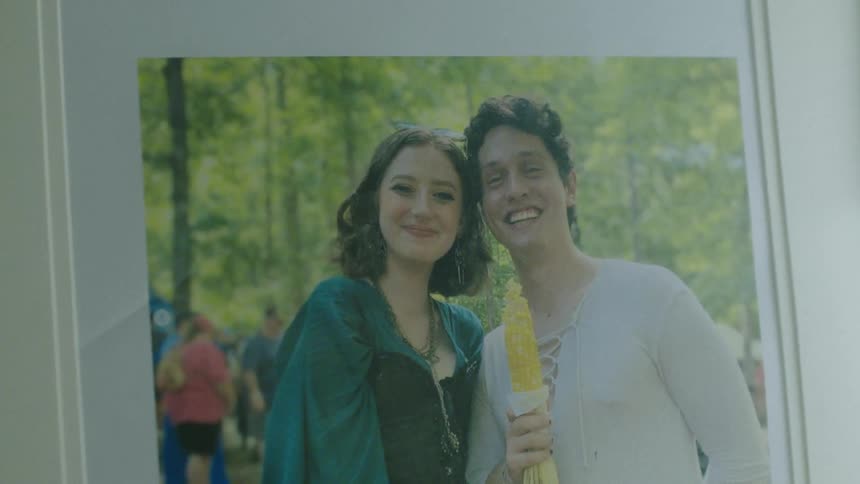A photo of a couple friends in the woods
