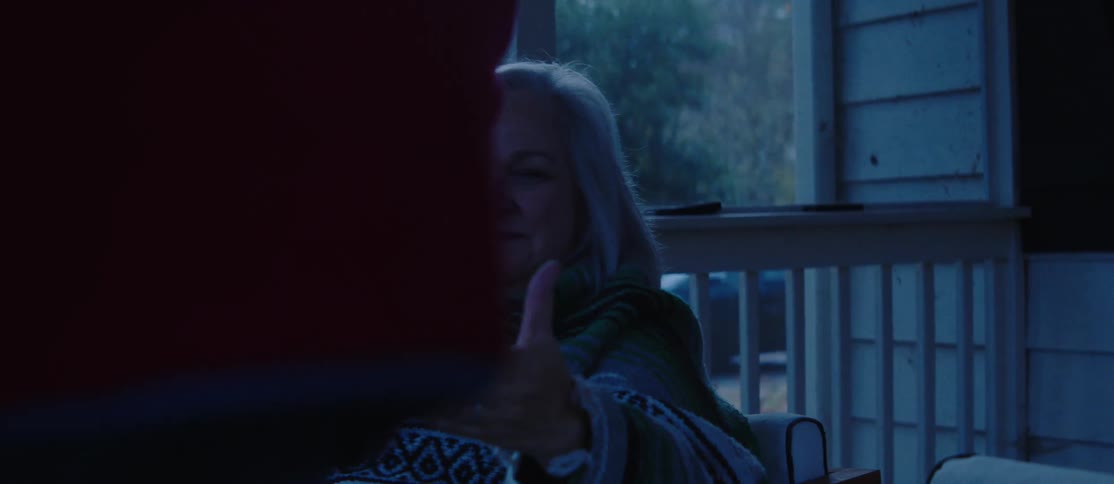 A clip of elderly couples having a drink at the balcony