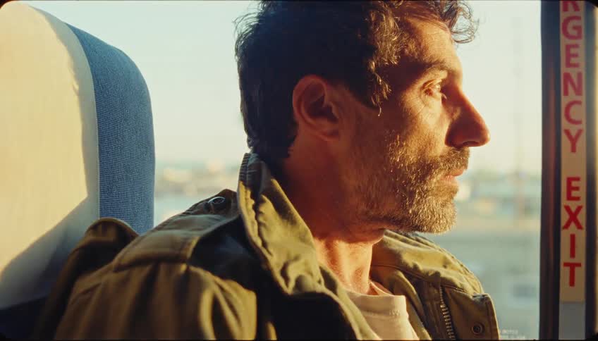 Man sitting inside a moving vehicle