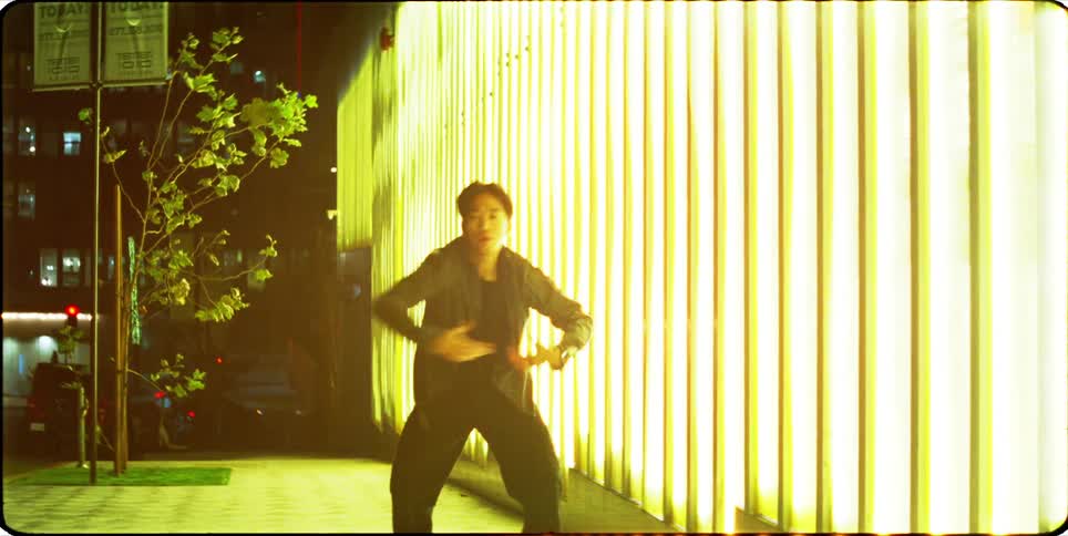 A clip of an asian person dancing outdoor