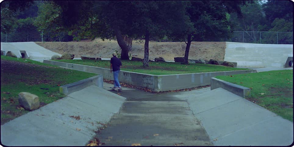 Young man skateboarding on an outdoor rink