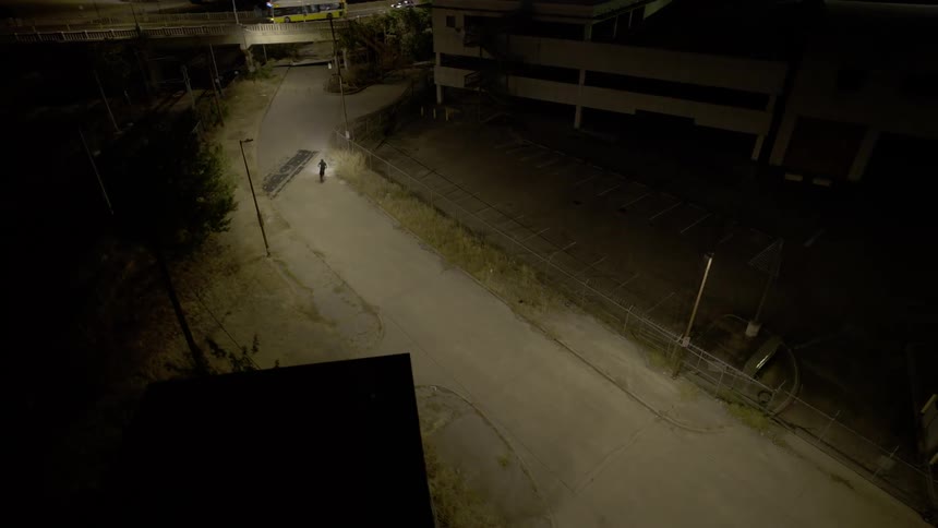 A motorcycle drives to the main road
