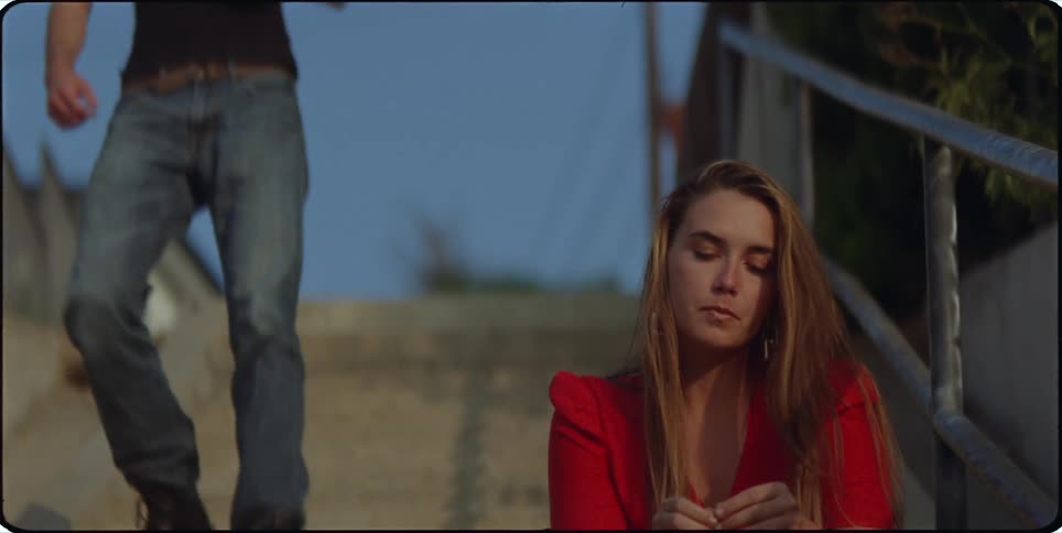 A clip of a male and female sitting beside each other