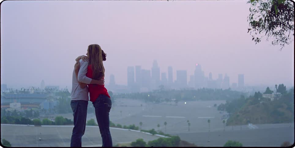 A clip of a male and woman hugging