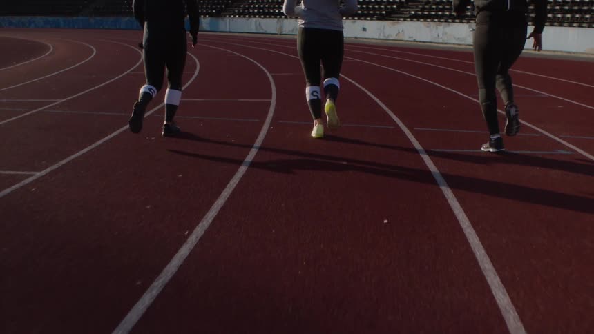 Women are running on the track