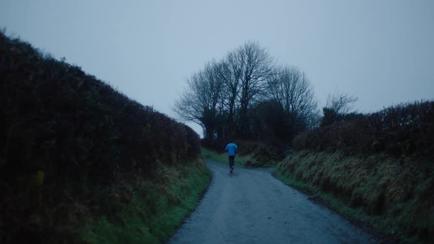 A footage of a person running in the morning