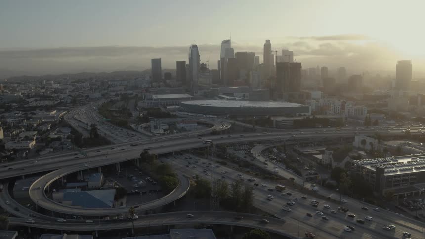 Traffic flows along freeways in a city at dawn or dusk
