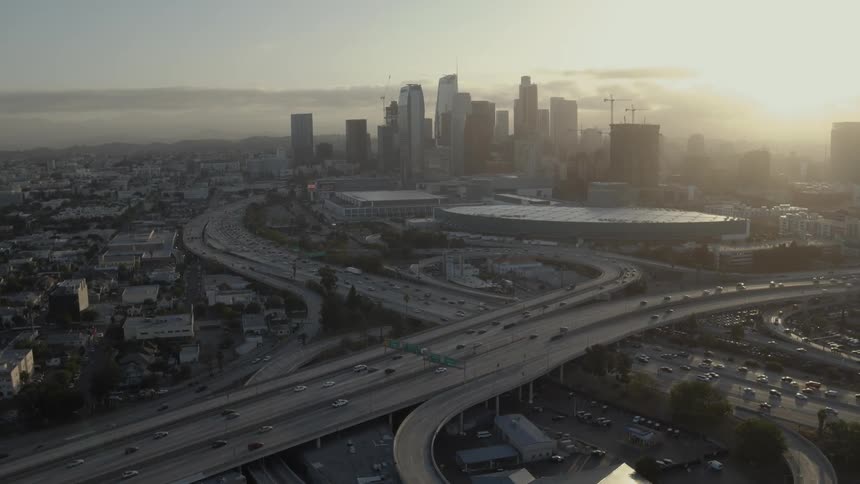 Vehicles travel along a busy highway overpass