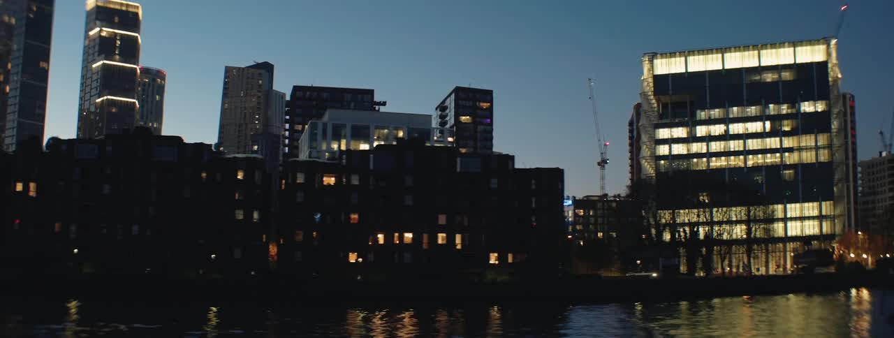 Urban buildings illuminated at night in a metropolis