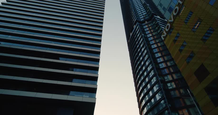 Upward view of modern skyscrapers in a metropolis during daytime