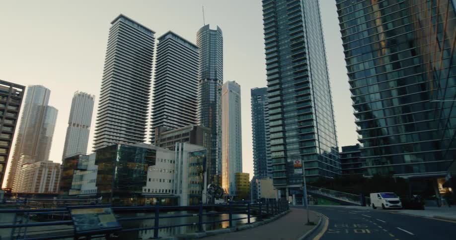 A woman crosses the street in the big city