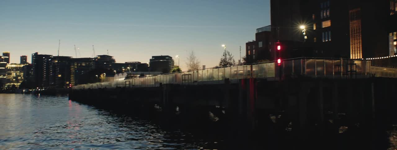 The sun is rising on the city by the water