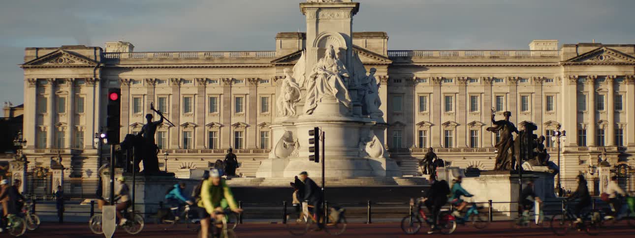 Buckingham palace in london with the statue of queen victoria prominently displayed in front