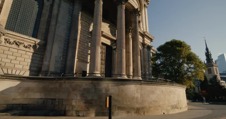 Building with classical architecture in a metropolis on the side of a highway