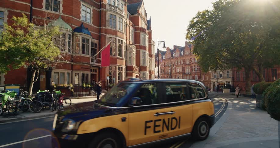 A taxi takes a turn in the city