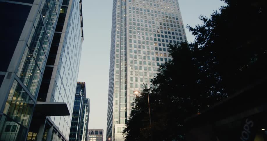 Modern skyscraper surrounded by other tall buildings in an urban area