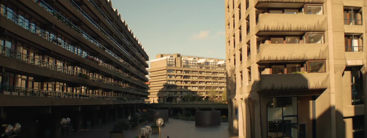 Complex of buildings with brutalist architecture with exposed concrete structures and straight lines