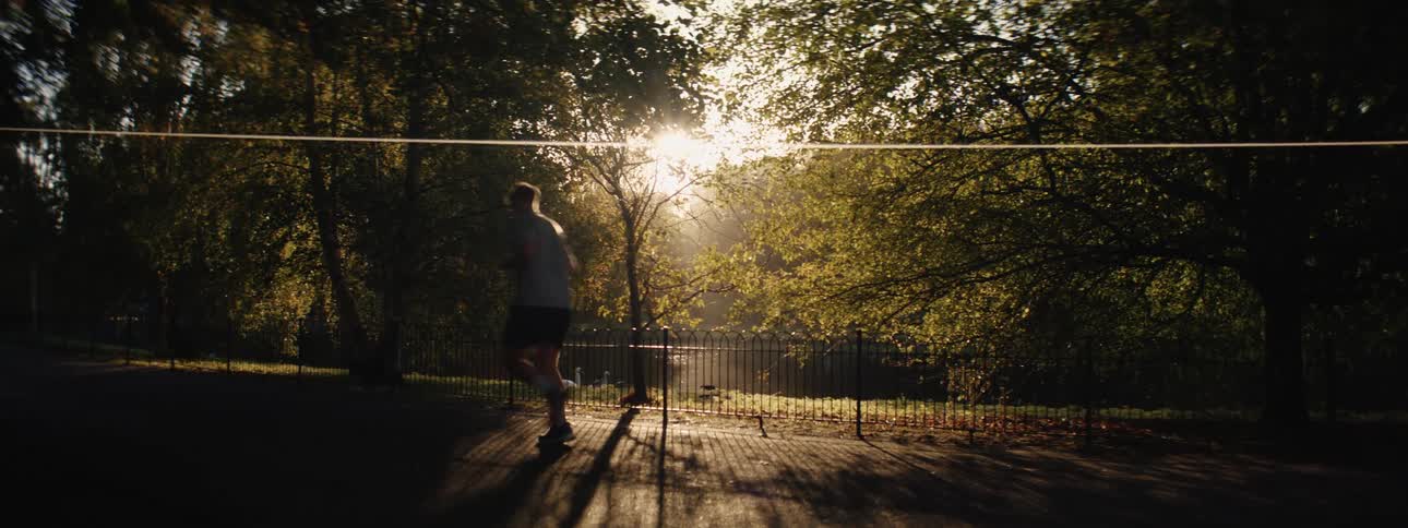 A clip of a person running in the park