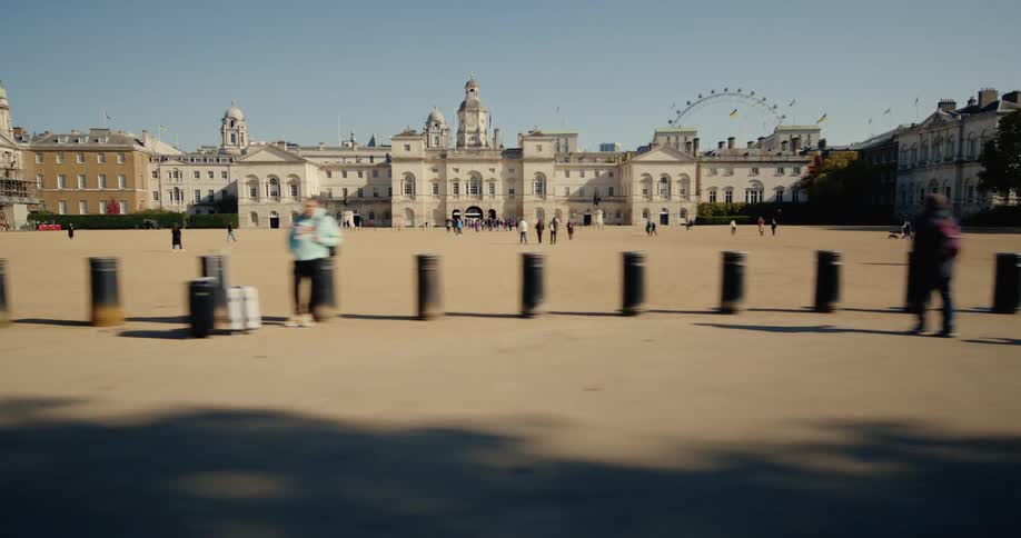 People walking in a public square with buildings around