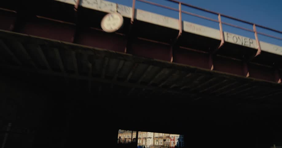 A car drives under overpasses in the city