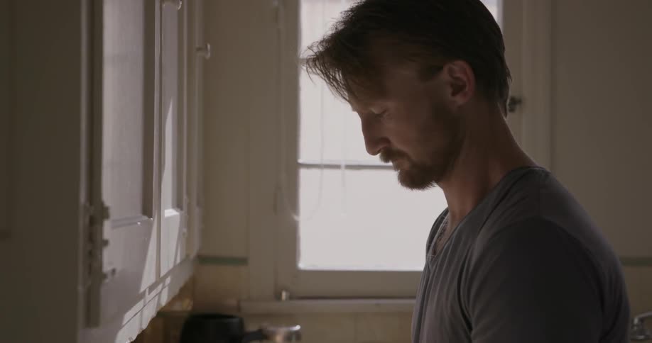 A man prepares food in a kitchen