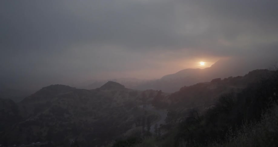 The sun is setting in the distance