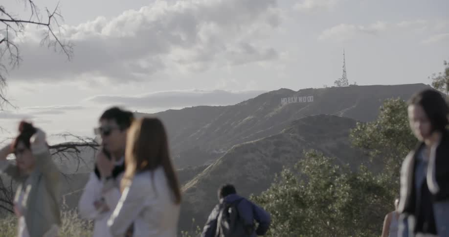 People are looking at the view of a mountain around them